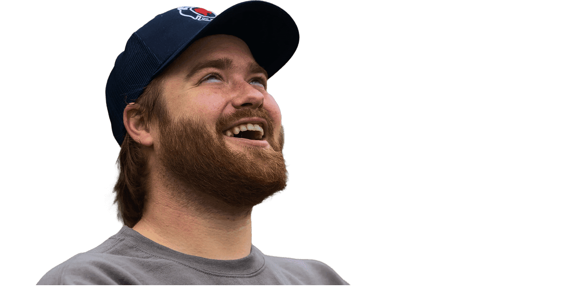 Walker Foreman smiling while holding a delivery bag.
