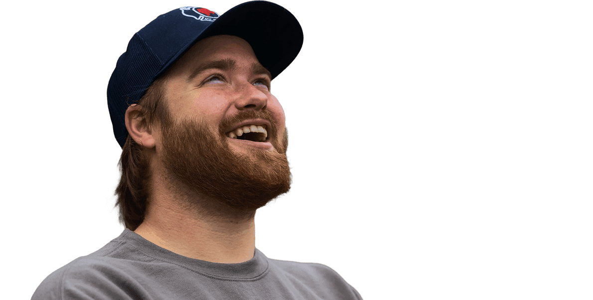 Walker Foreman smiling while holding a delivery bag.