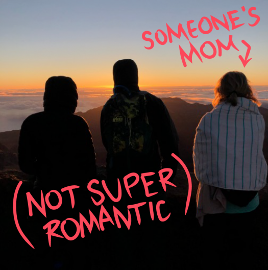 Image of tourists looking at sunset with "SOMEONE'S MOM" and an arrow pointing to them, and also the text "NOT SUPER ROMANTIC" scrawled on the bottom left corner. 